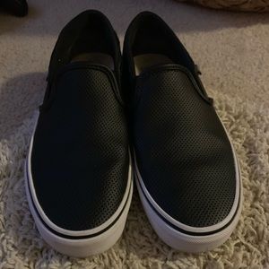 black leather perforated van slip ons